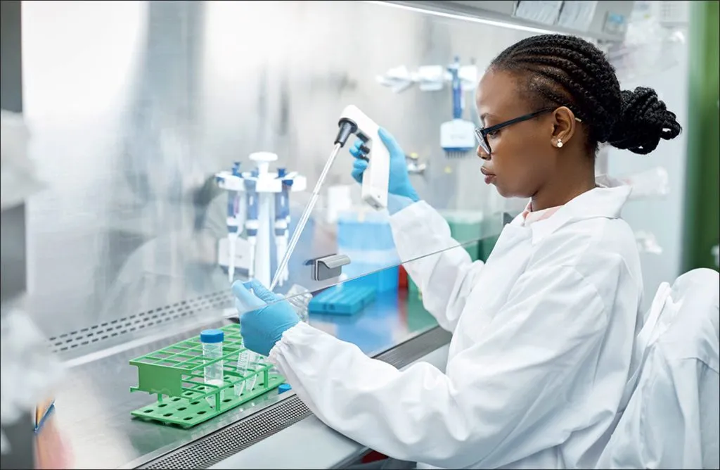 Laboratory scientist preparing samples with a pipette