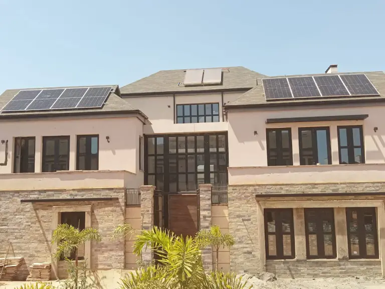 Completed solar panels installed across the roof of a large residence
